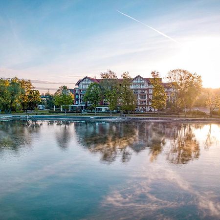 Willa Port Ostroda Exterior photo The lake at the campus of the University of Applied Sciences and Medical University of Southern Tyrol