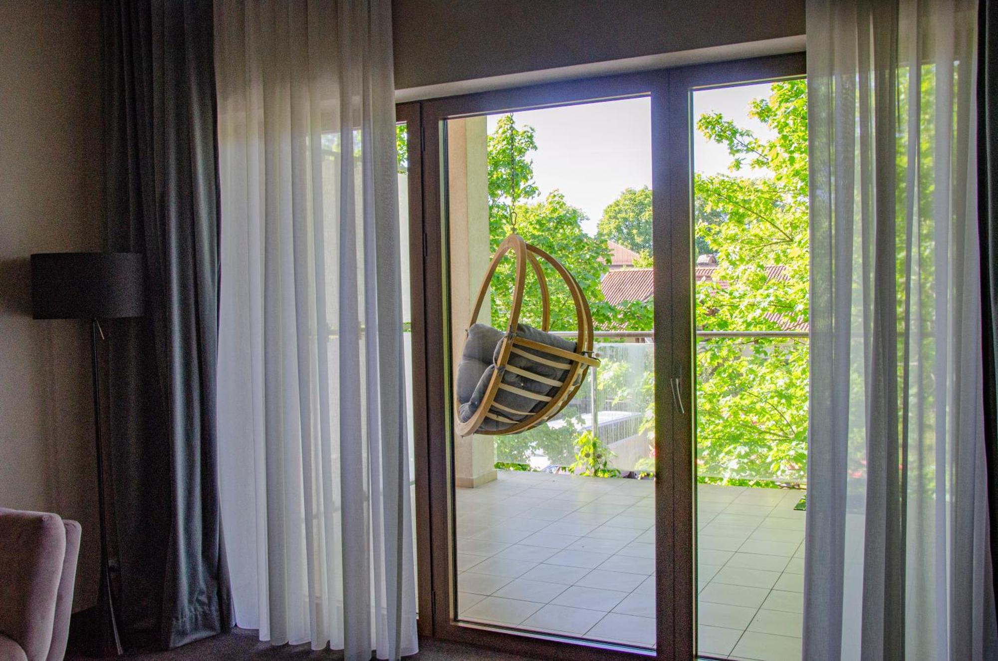 Willa Port Ostroda Exterior photo A hanging chair