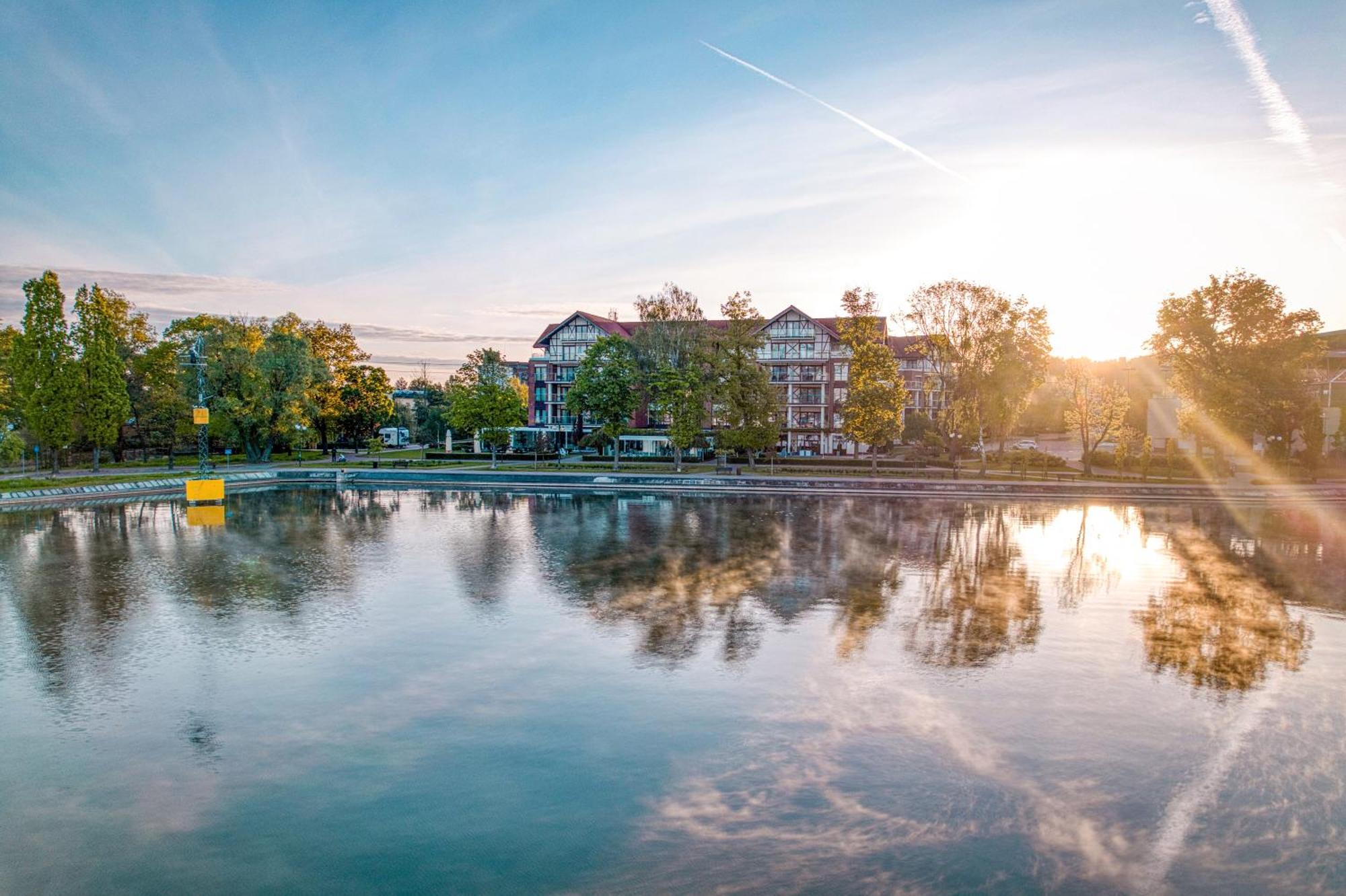 Willa Port Ostroda Exterior photo The lake at the campus of the University of Applied Sciences and Medical University of Southern Tyrol